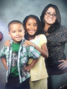 Adrian, Corrina and Rachel taking a family photo.